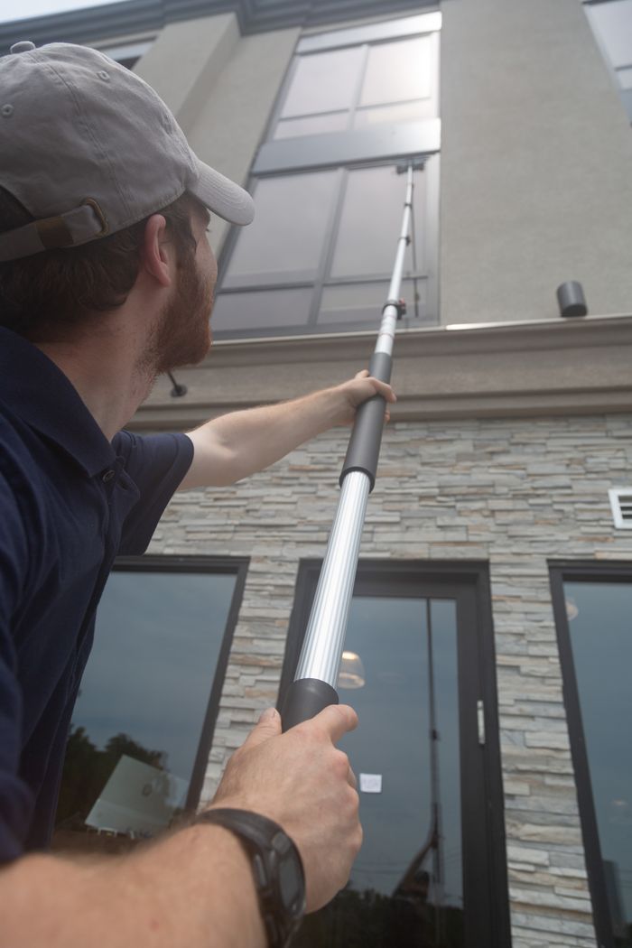 Person using a Miloo extension pole