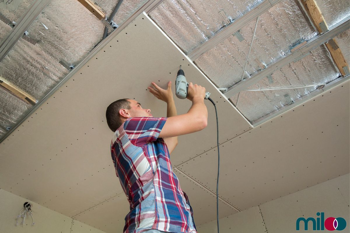 Installer stapling Miloo reflective insulation to a wall