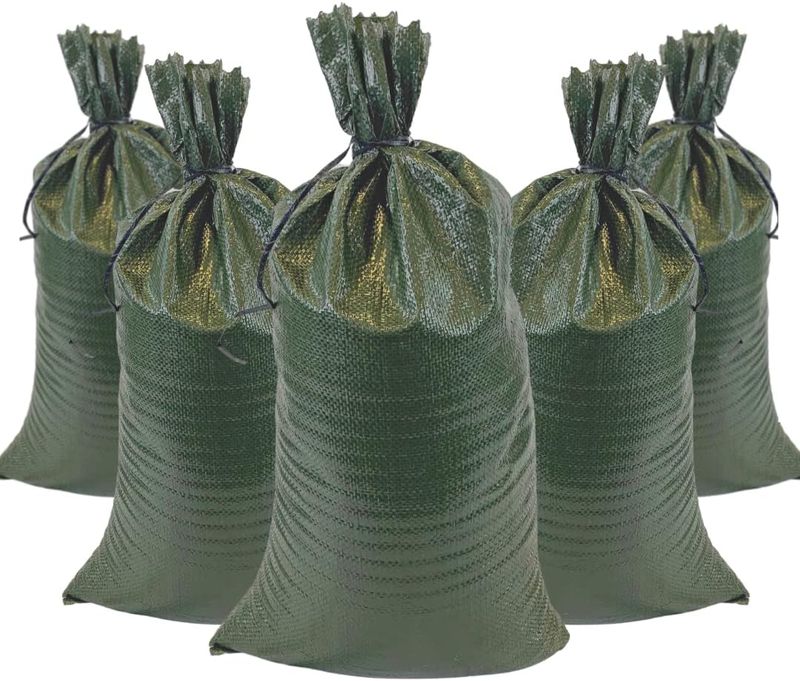 Stack of empty green sandbags